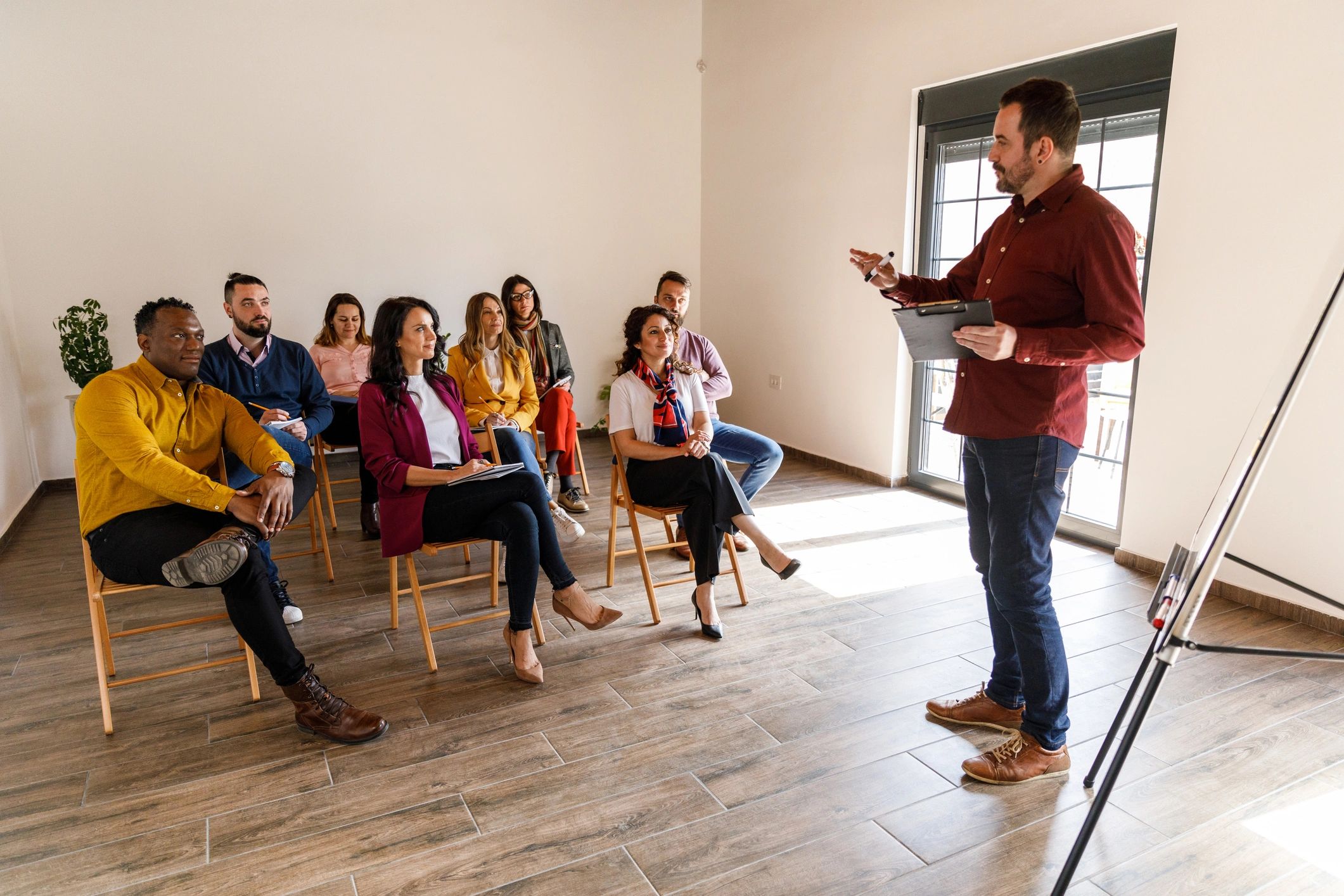 Leader teaching a small group in a practical training setting